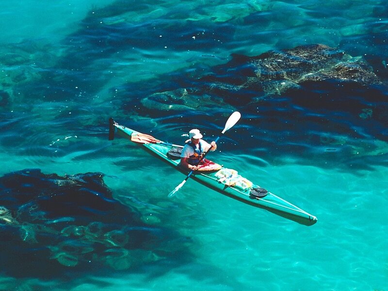kayaker in clear turquoise water