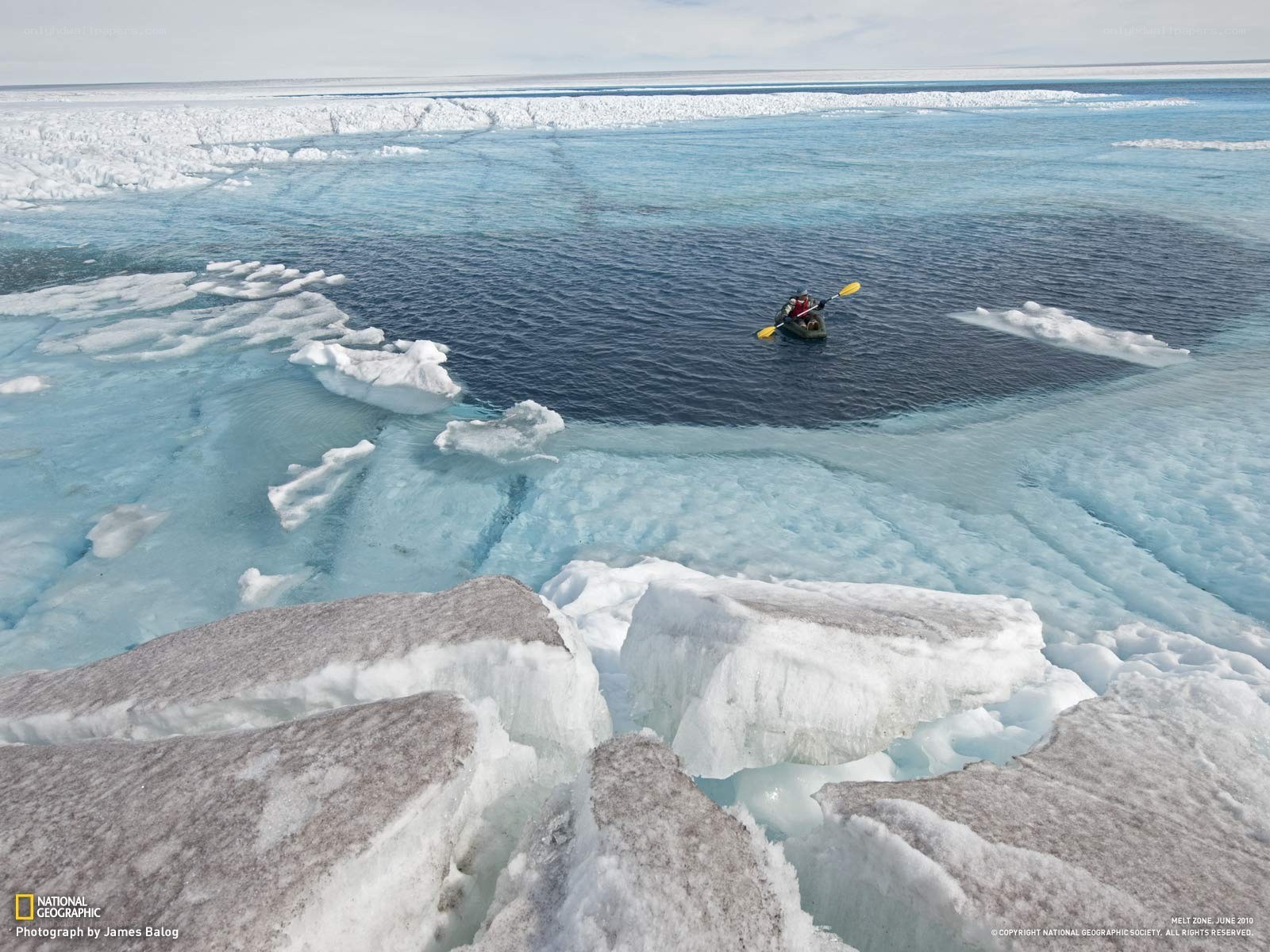 Kayaker in icy waters
