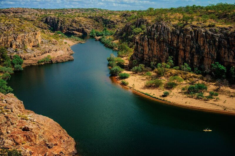 Kayaker in River Canyon