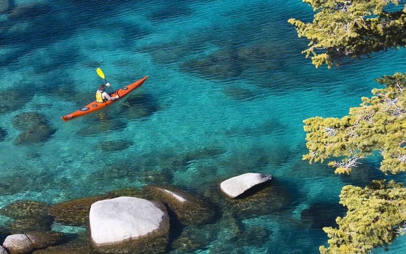 Kayaker in Turquoise Water — Blue, Serene, Afternoon, Photograph