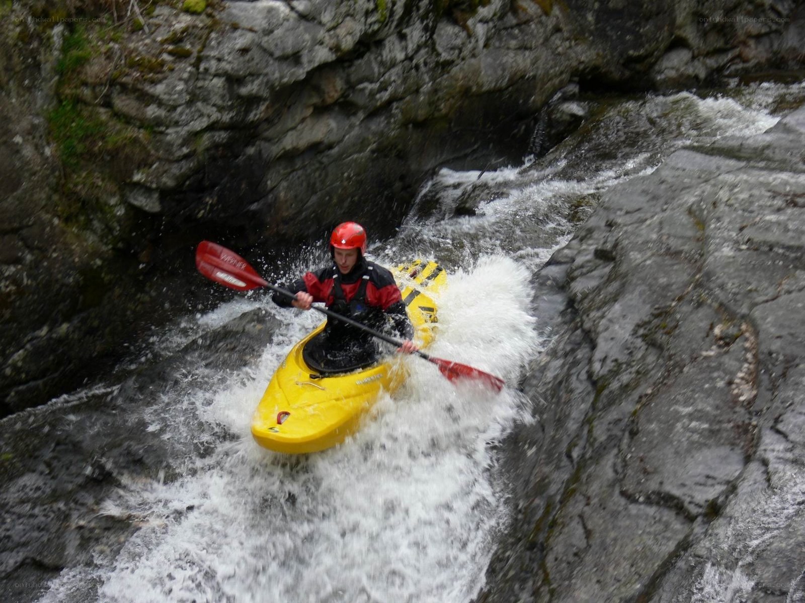 kayaker navigating rapids