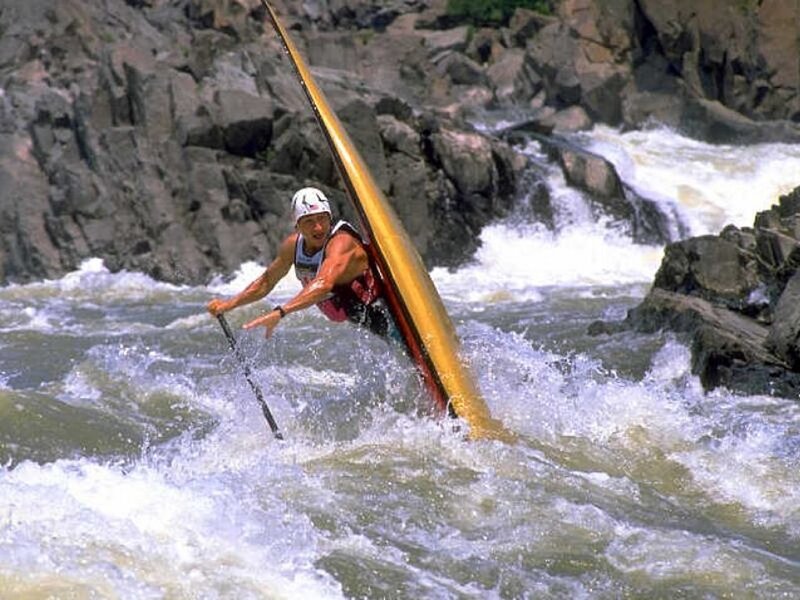 kayaker navigating rapids
