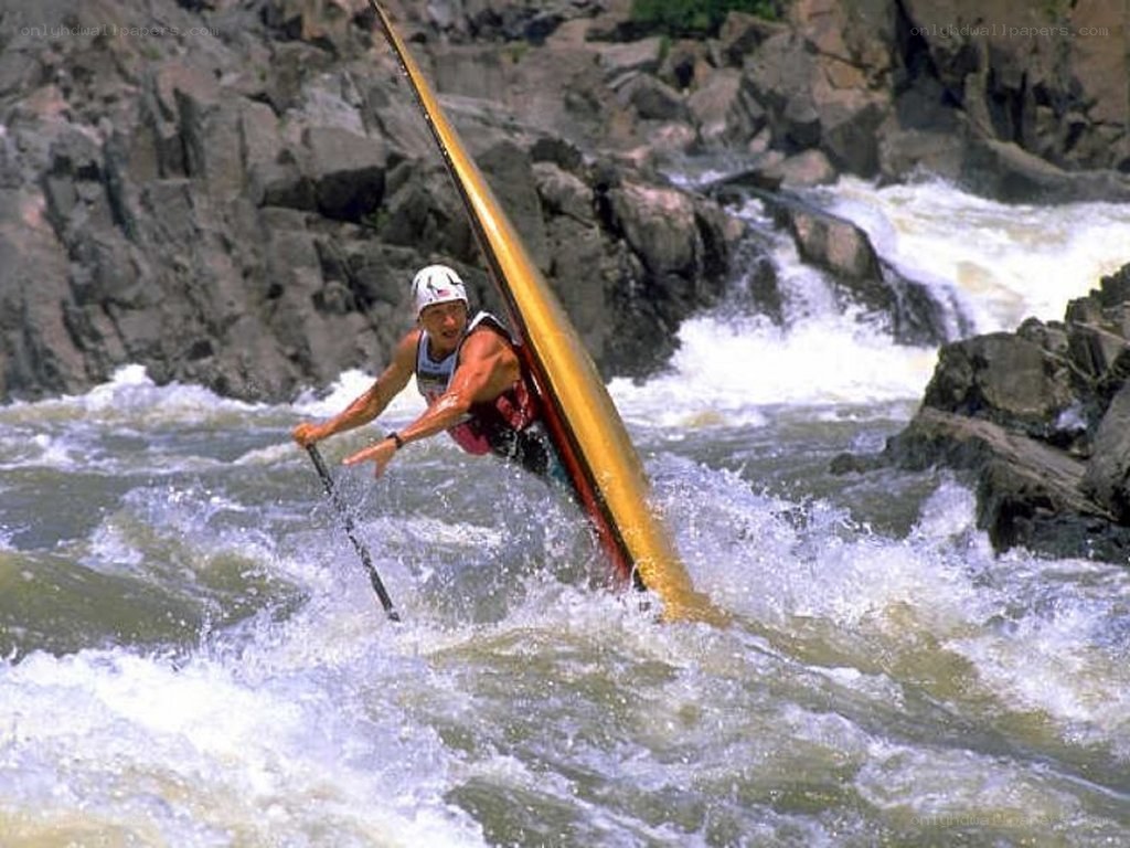 kayaker navigating rapids