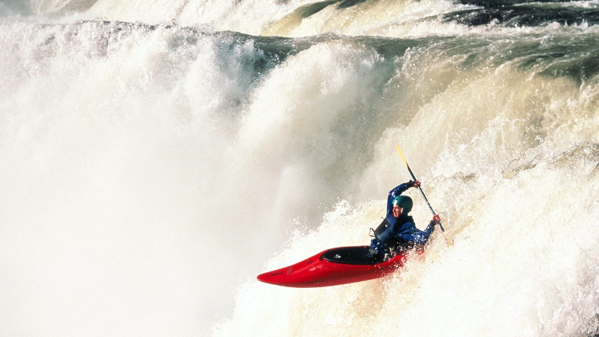kayaker navigating whitewater rapids