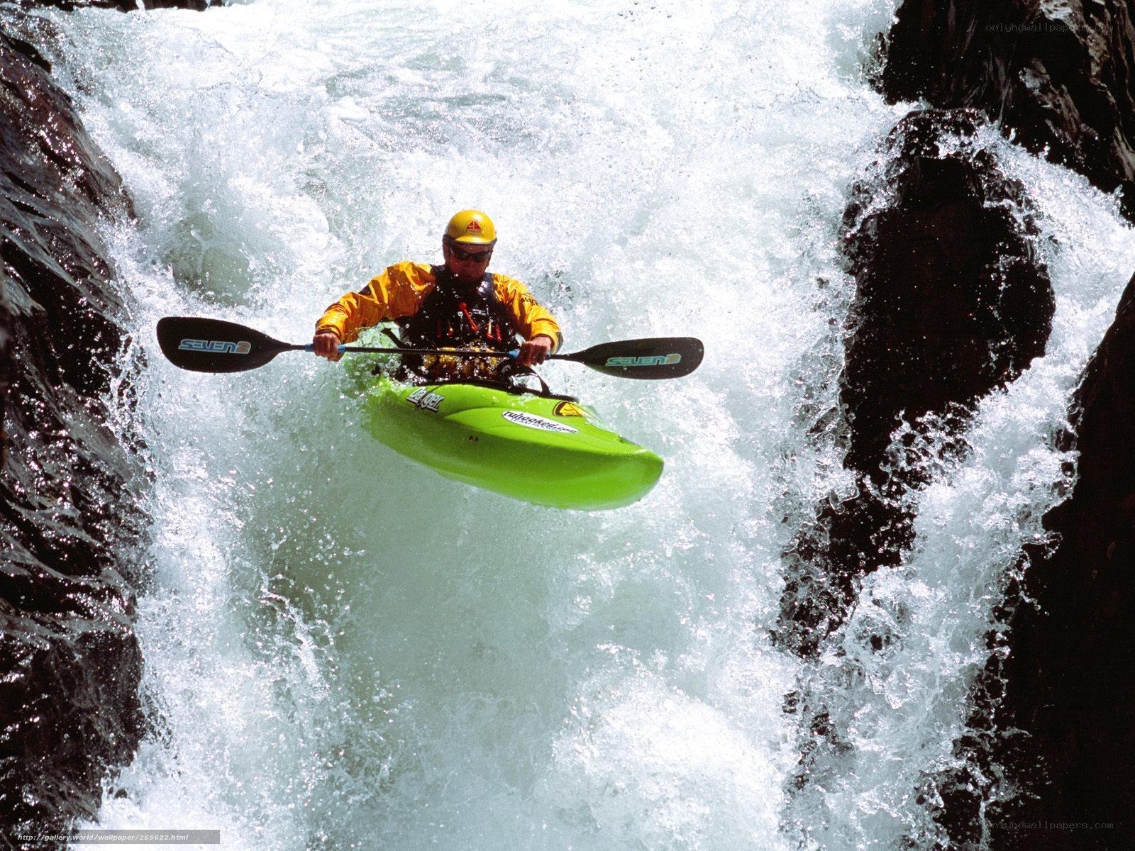 kayaker navigating whitewater rapids