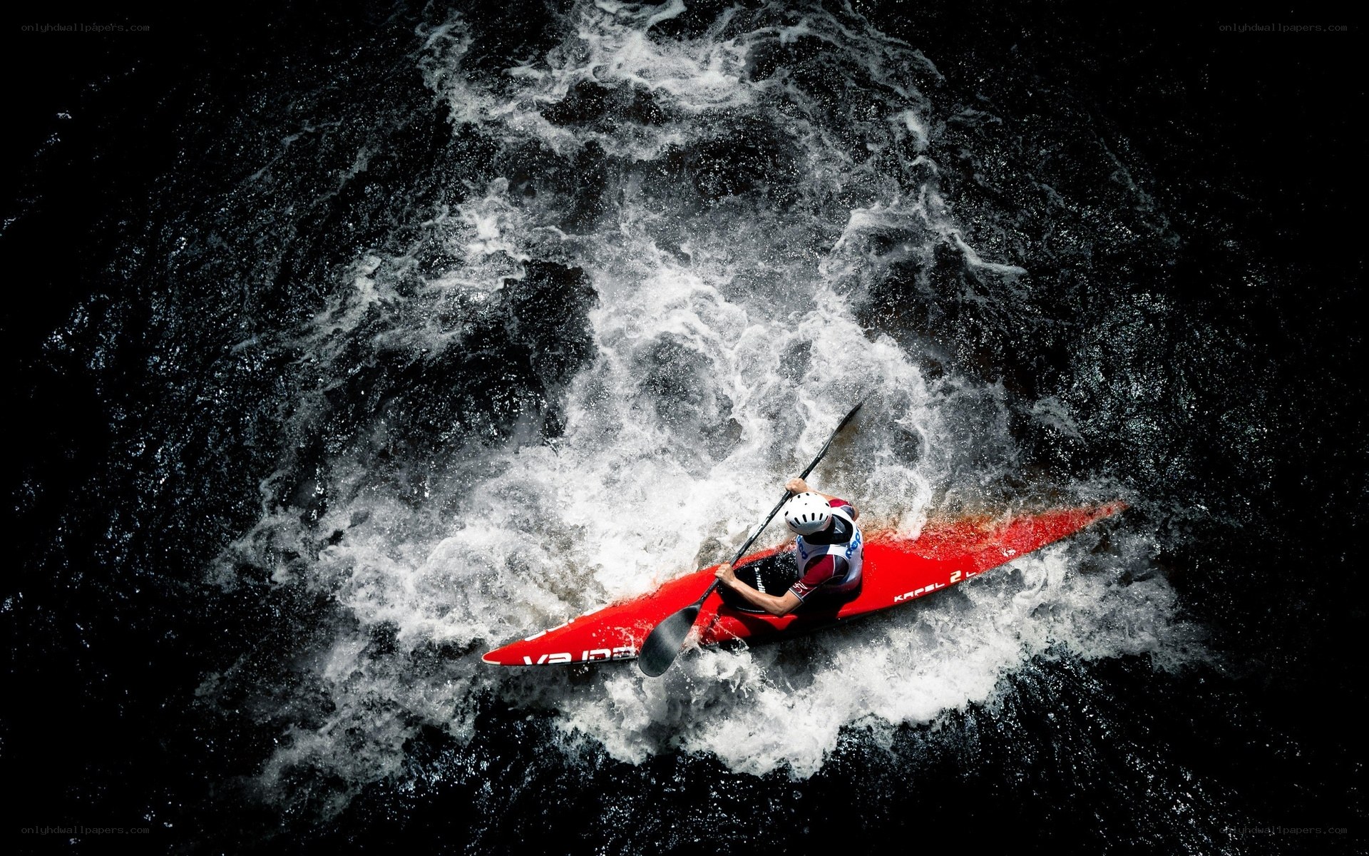 kayaker navigating whitewater rapids