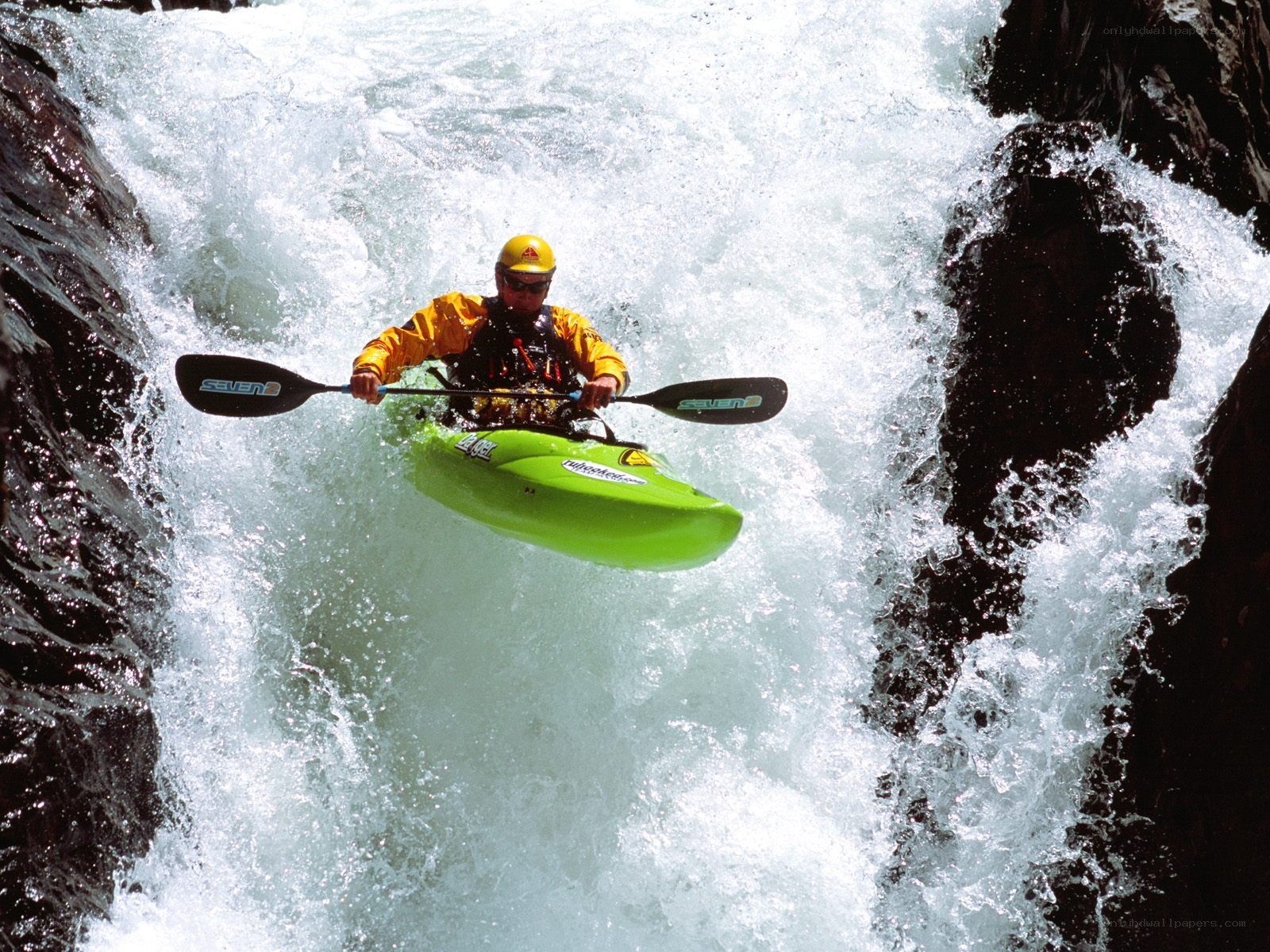 kayaker navigating whitewater rapids