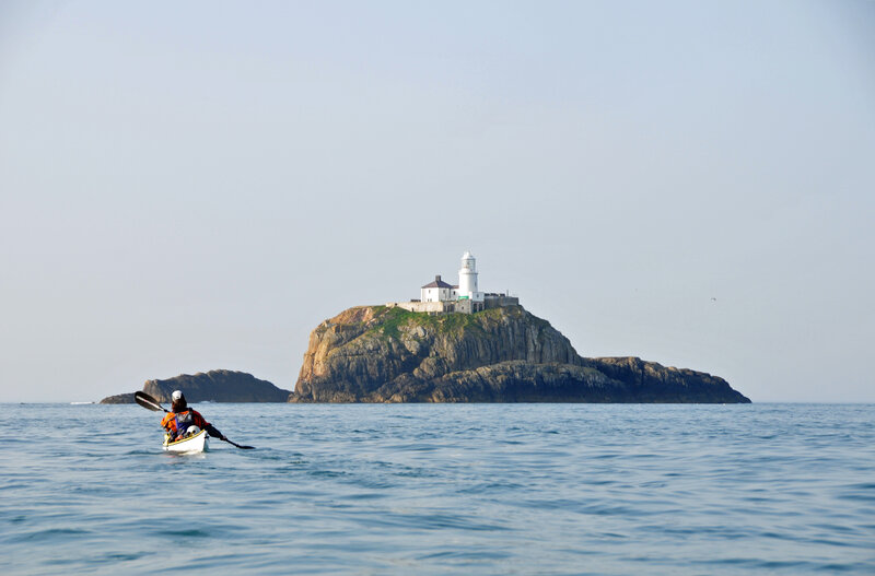 kayaker near lighthouse island