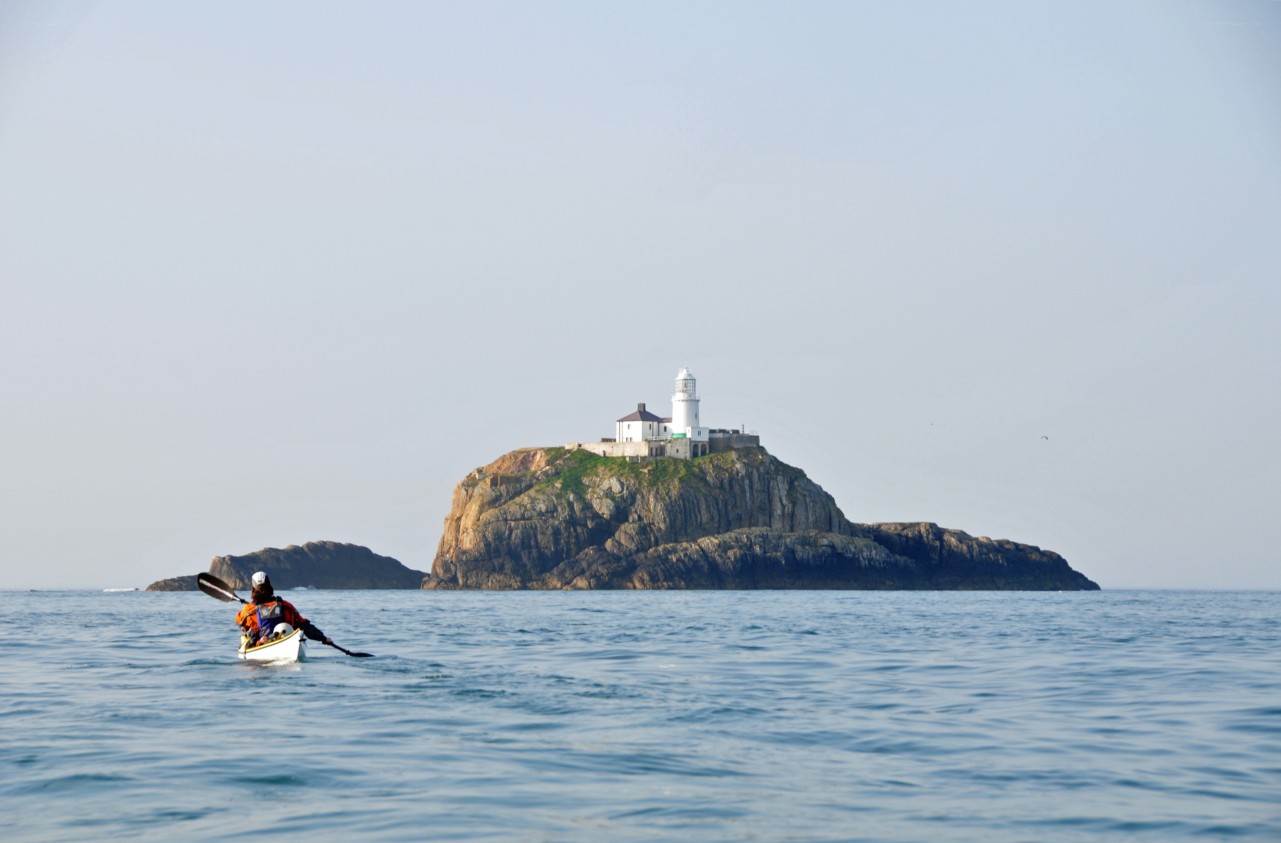 kayaker near lighthouse island