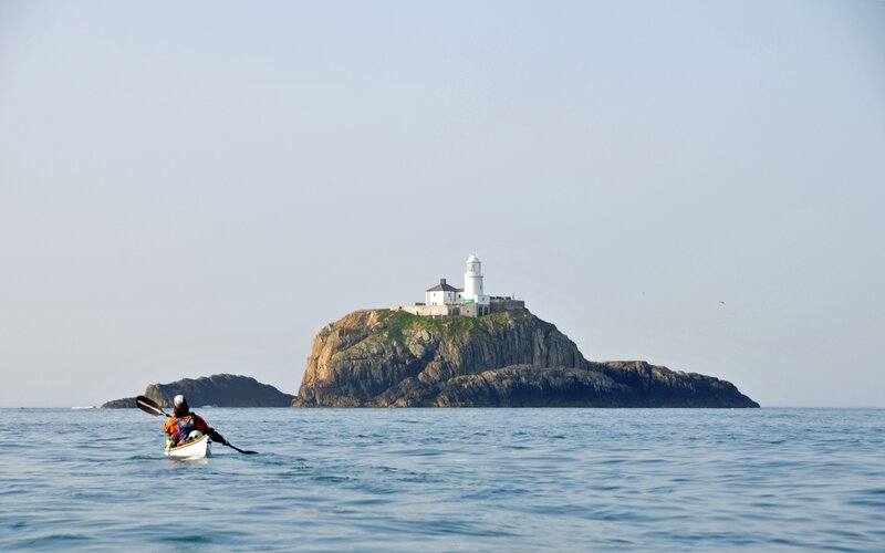 Kayaker Near Lighthouse