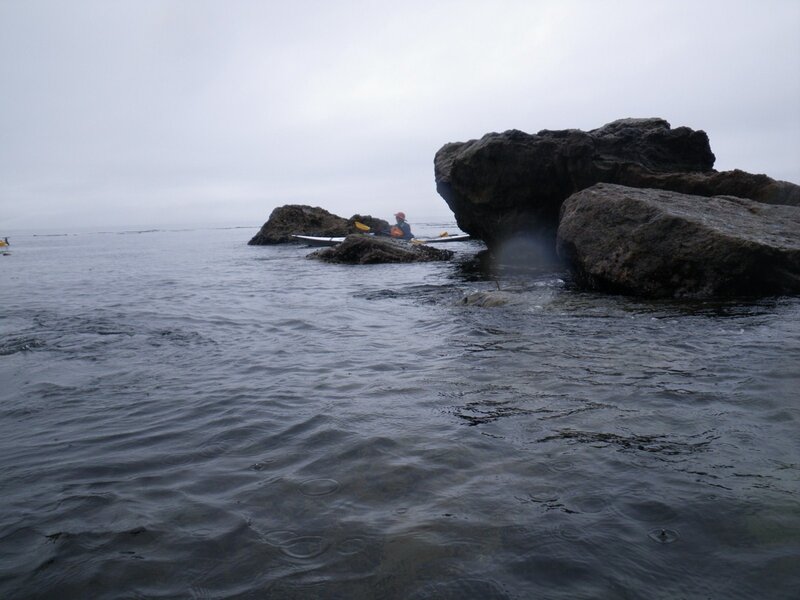 Kayaker Near Rocks