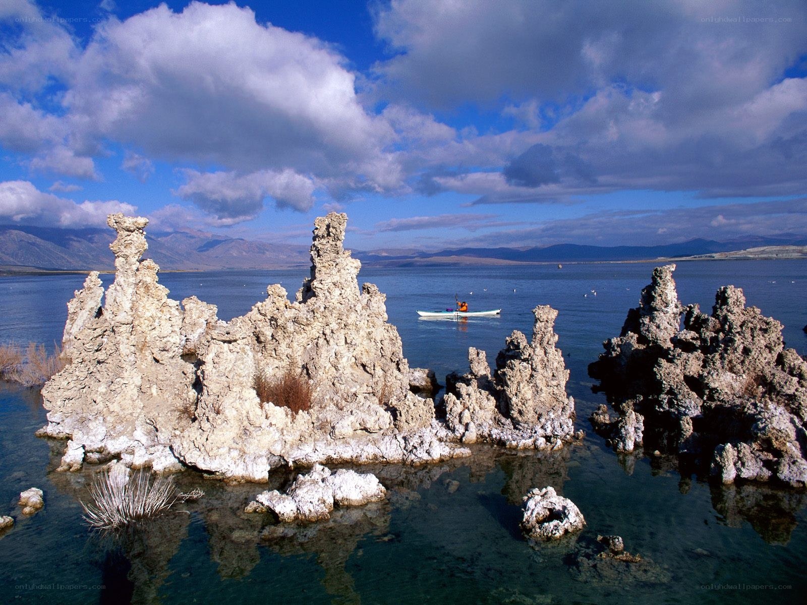 Kayaker near tufa formations