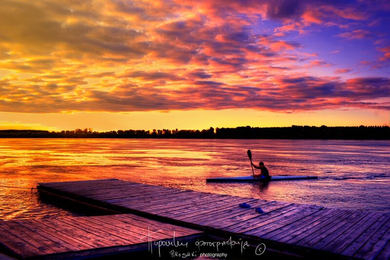 Kayaker on a Lake — Orange, Dramatic