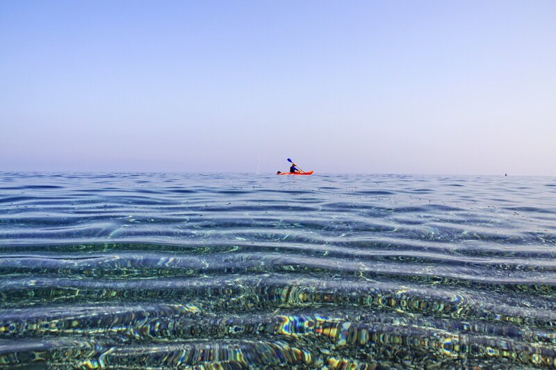 kayaker on calm sea