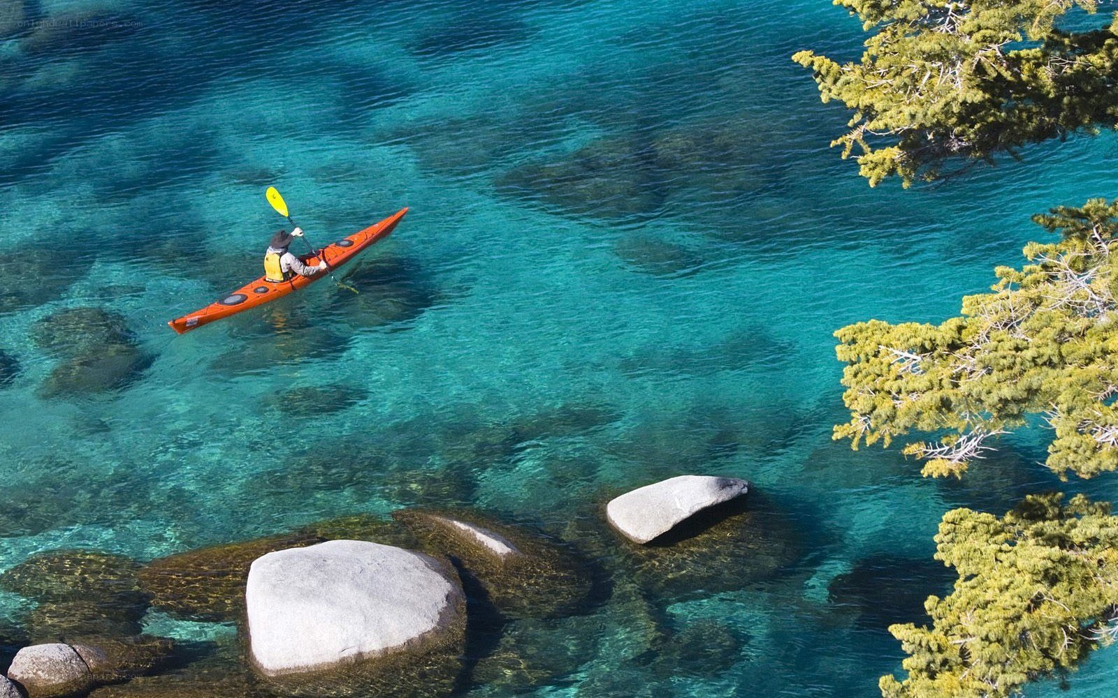 kayaker on clear blue water