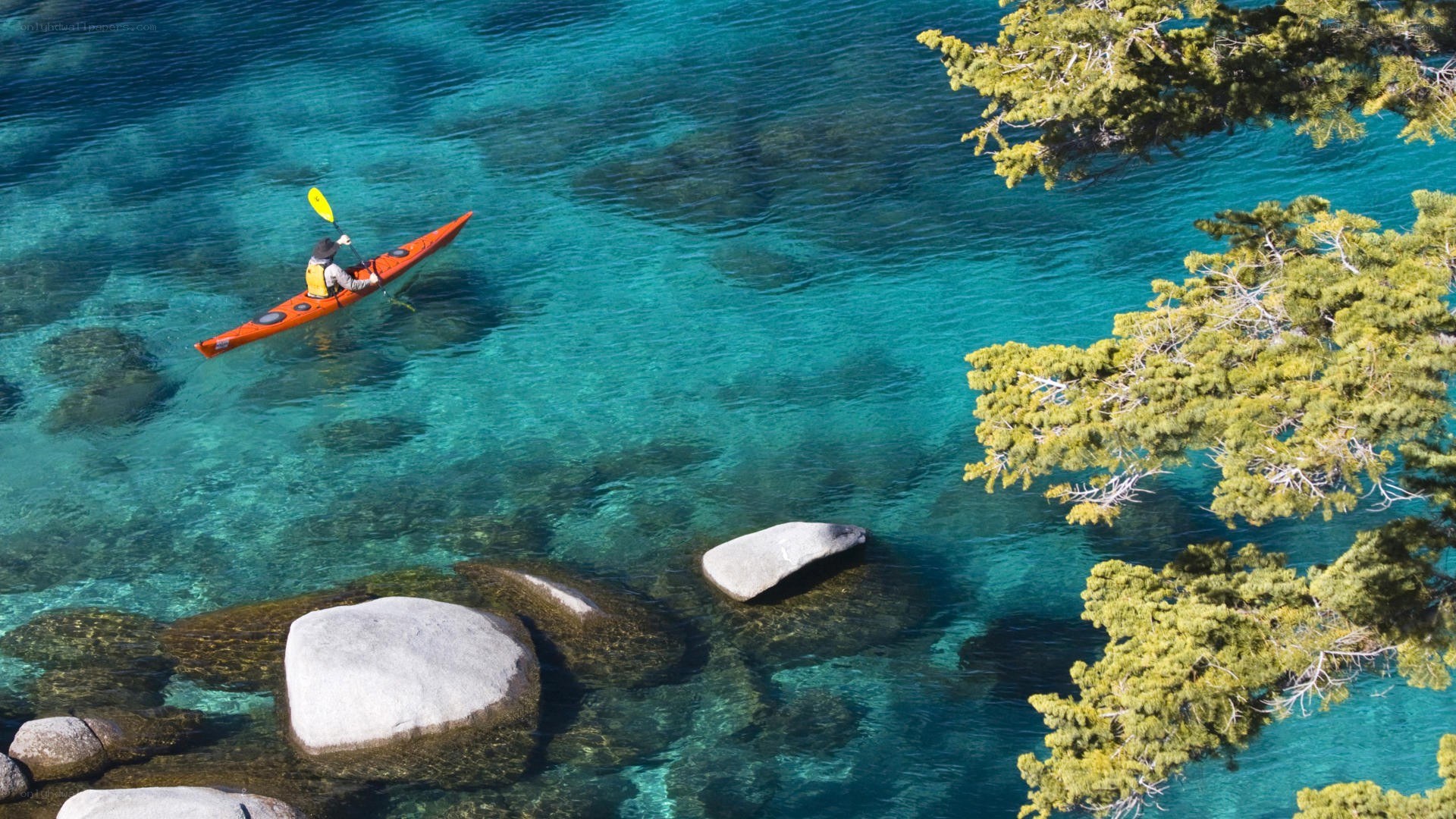 kayaker on clear blue water