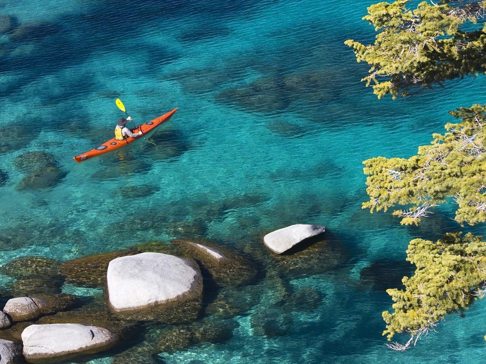 kayaker on clear blue water