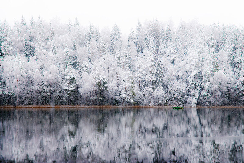 Kayaker on Snowy Lake