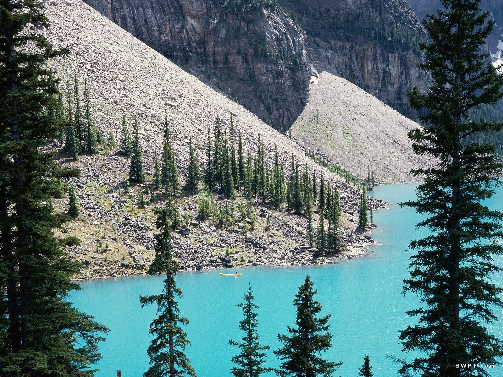 kayaker on turquoise lake