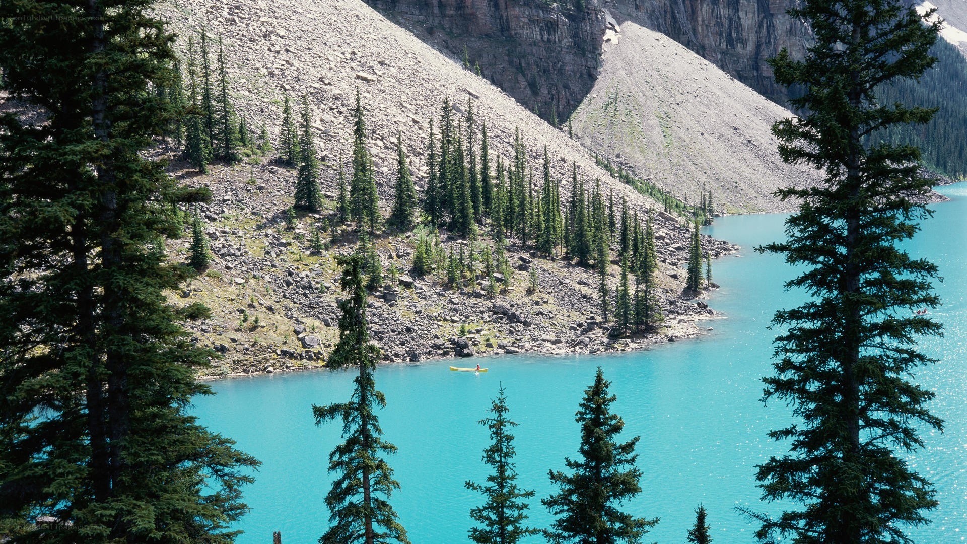 Kayaker on turquoise lake