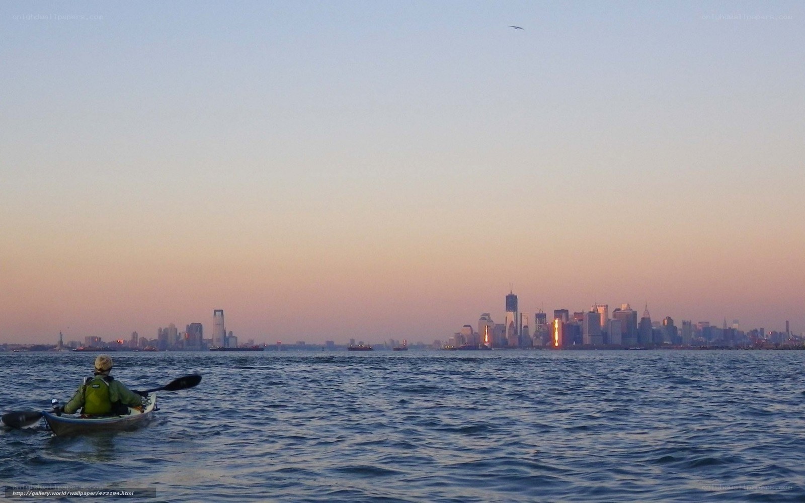 kayaker on water at sunset