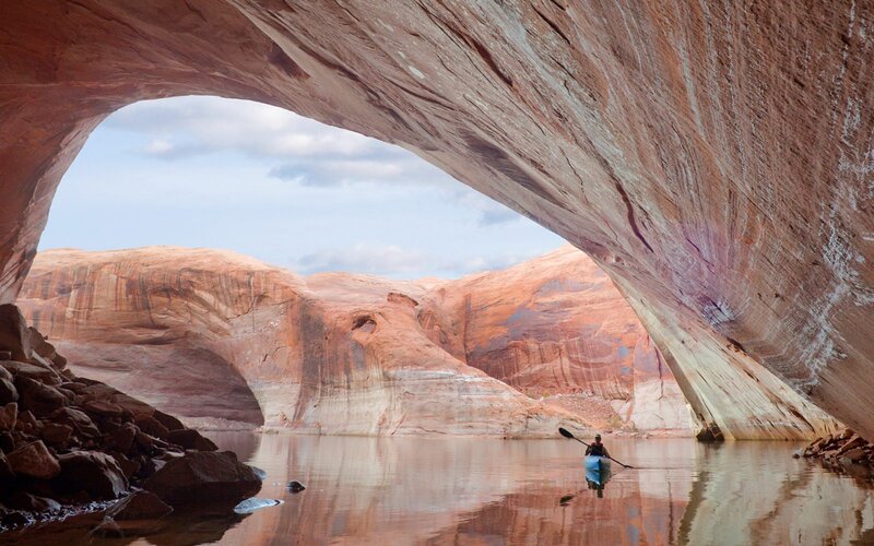Kayaker under Rock Arch — Red