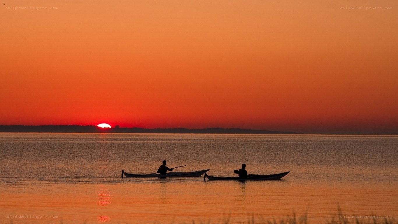 Kayakers at sunset