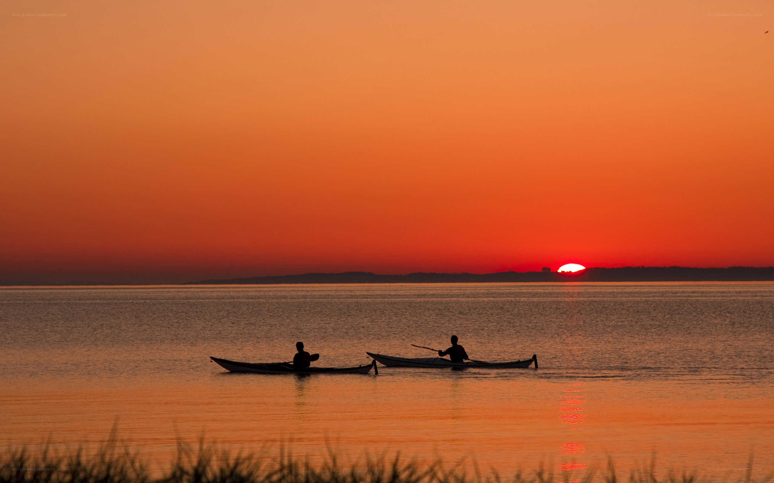Kayakers at sunset