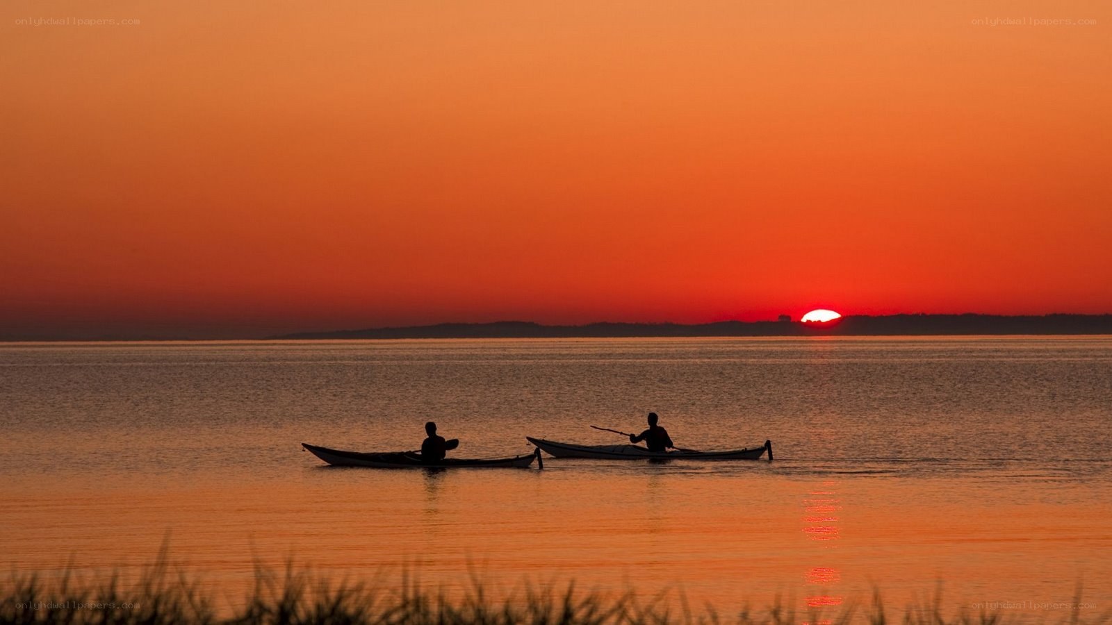 Kayakers at sunset