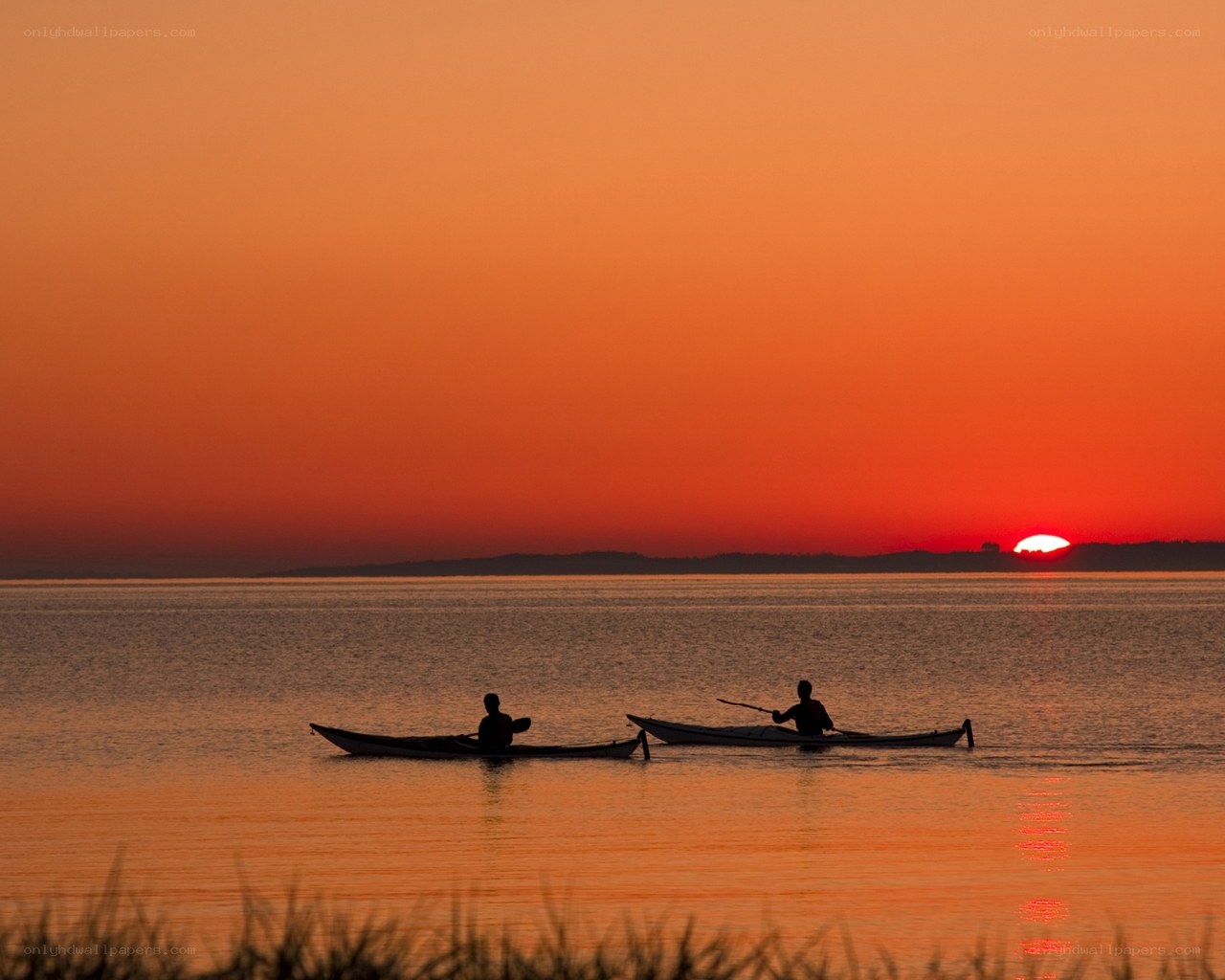 Kayakers at sunset
