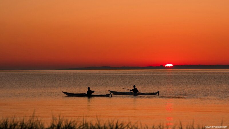Kayakers at sunset