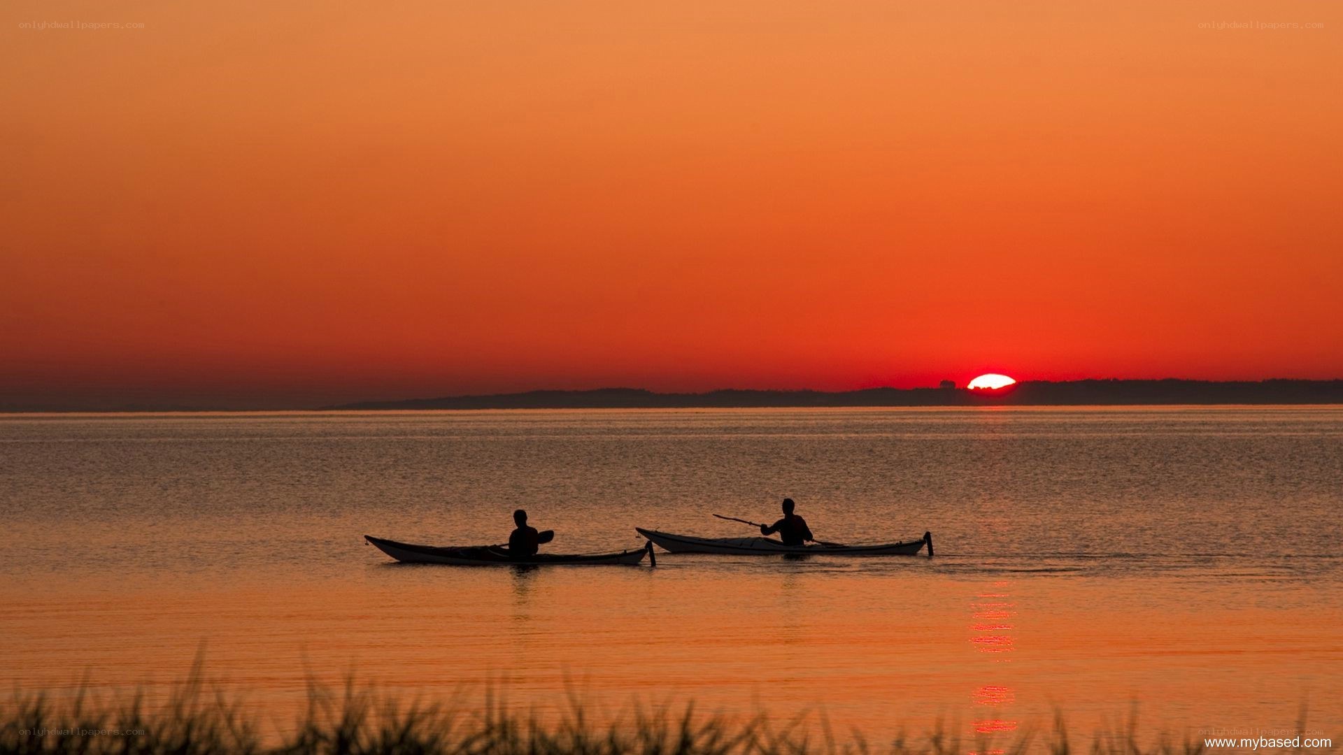 Kayakers at sunset