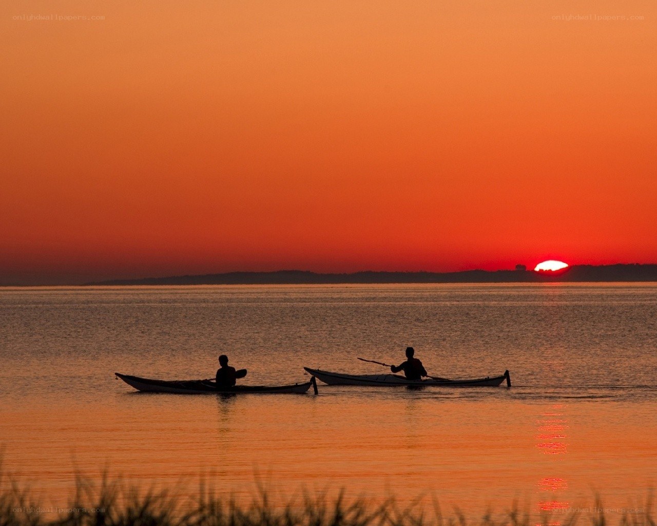 Kayakers at sunset