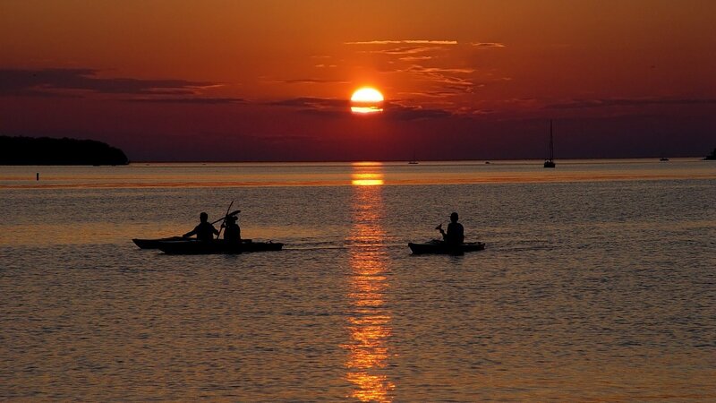 Kayakers at sunset