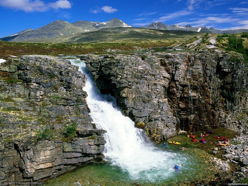 Kayakers at Waterfall