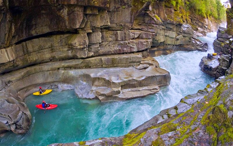 Kayakers in River Canyon — Blue