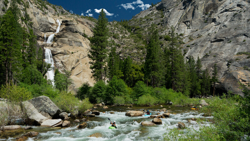 Kayakers in River Rapids