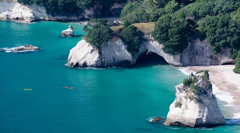 kayakers near a sea cave