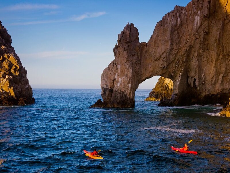 Kayakers Near Rock Arch