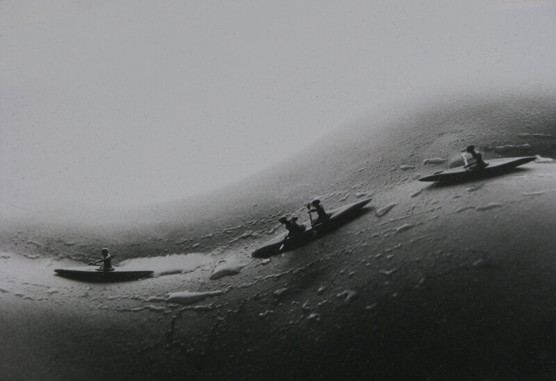 Kayakers on a foggy river