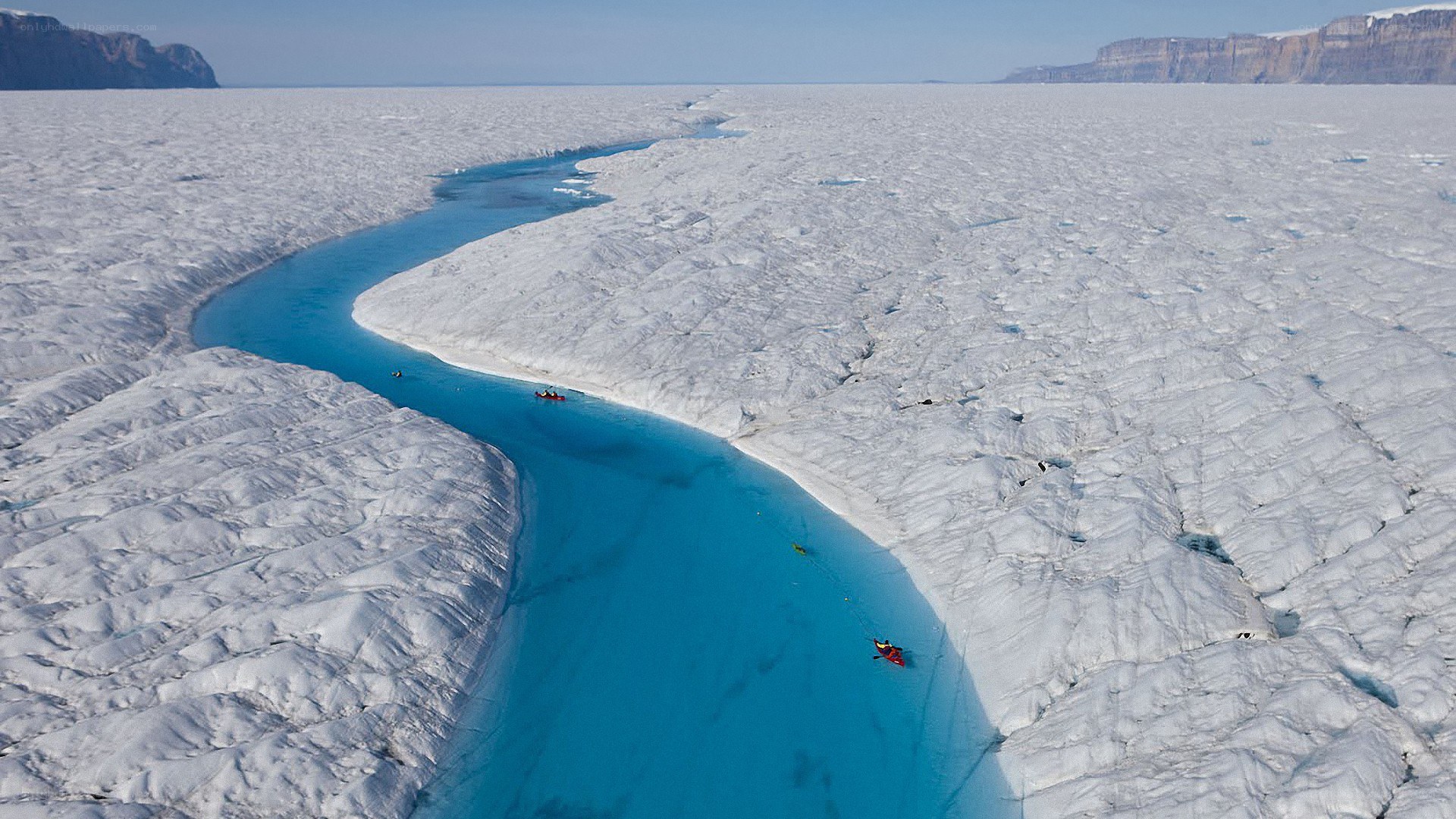 Kayakers on glacial river