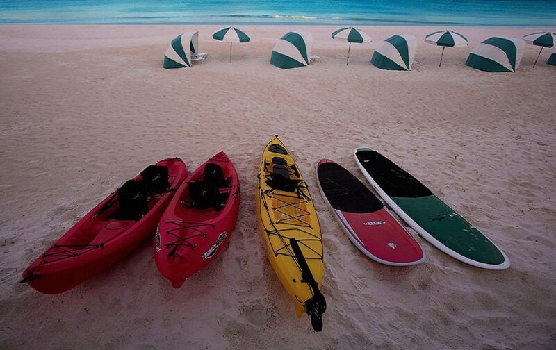 Kayaks and Paddleboards on Beach