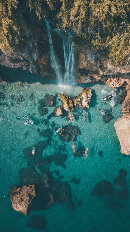 Kayaks Near Waterfall