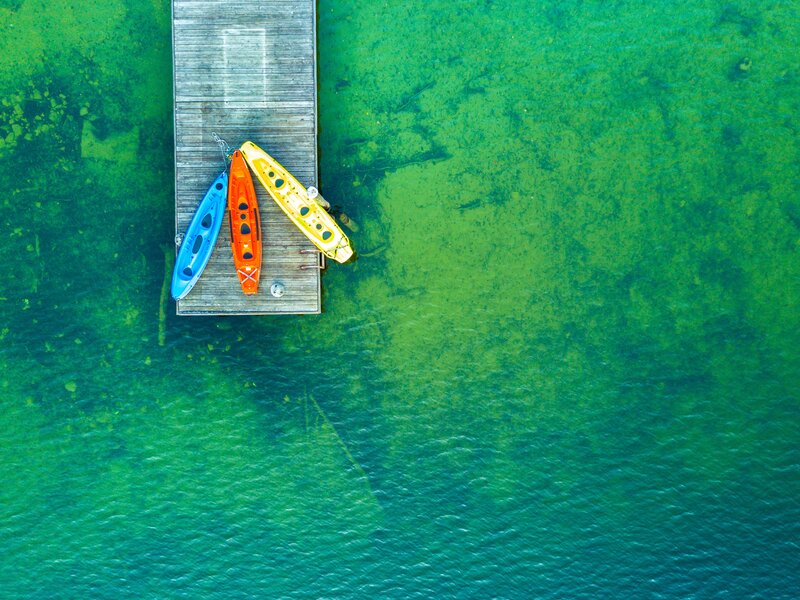 Kayaks on a Dock — Green