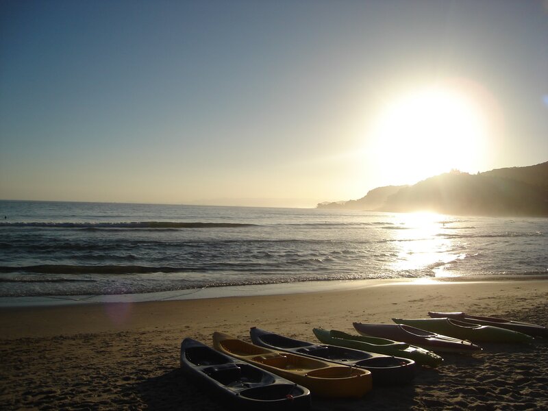 Kayaks on Beach — Blue