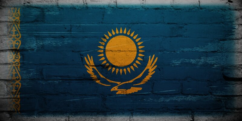Kazakhstan flag on brick wall