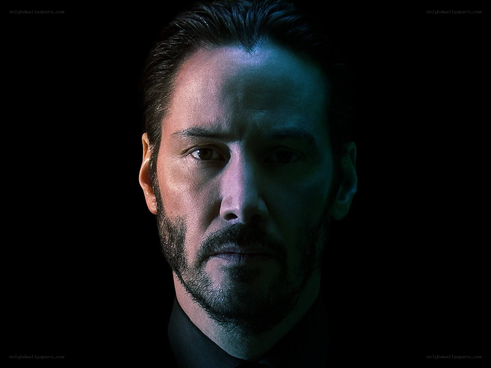 Keanu Reeves in dark portrait