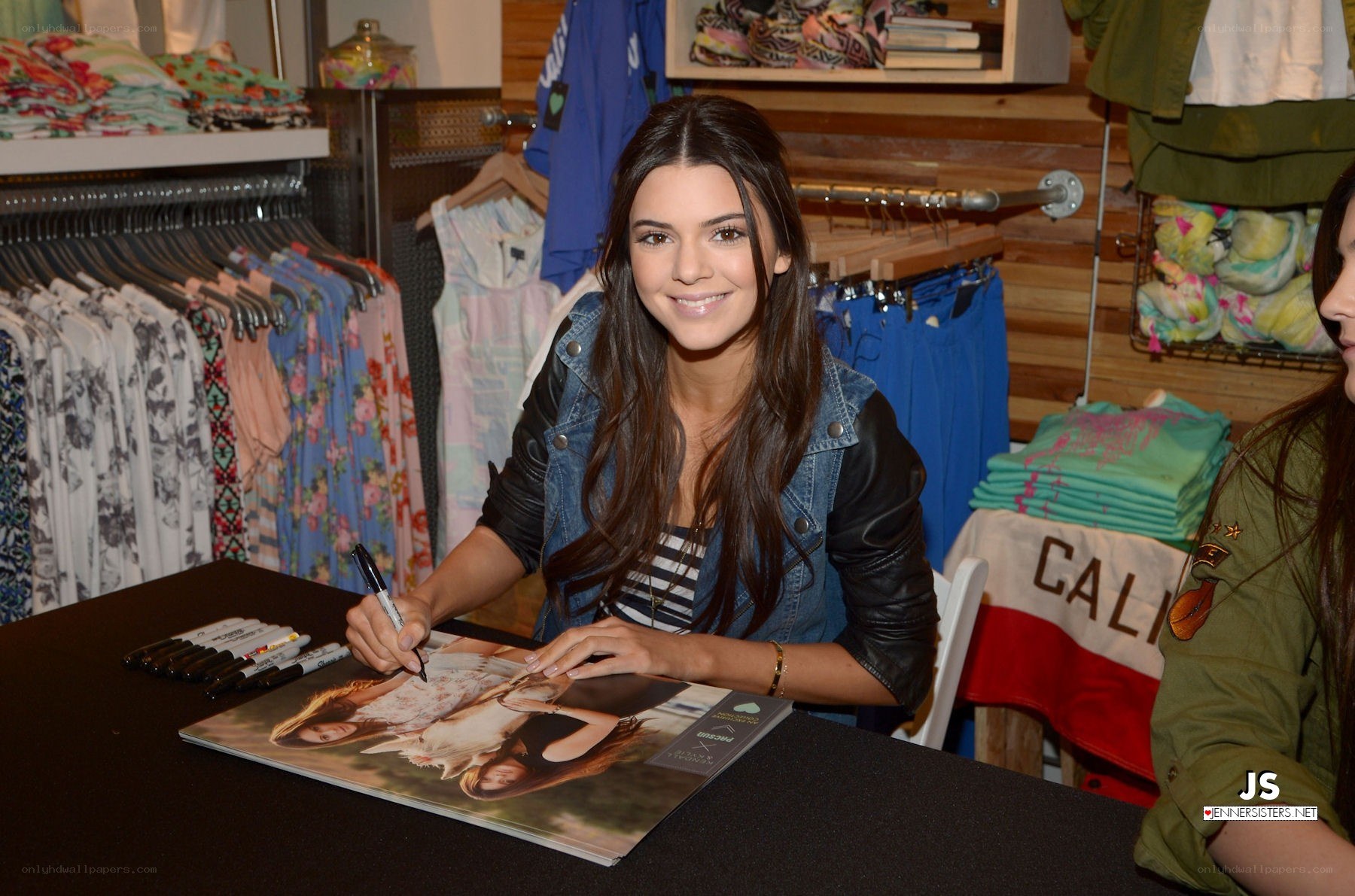 Kendall Jenner signing autograph