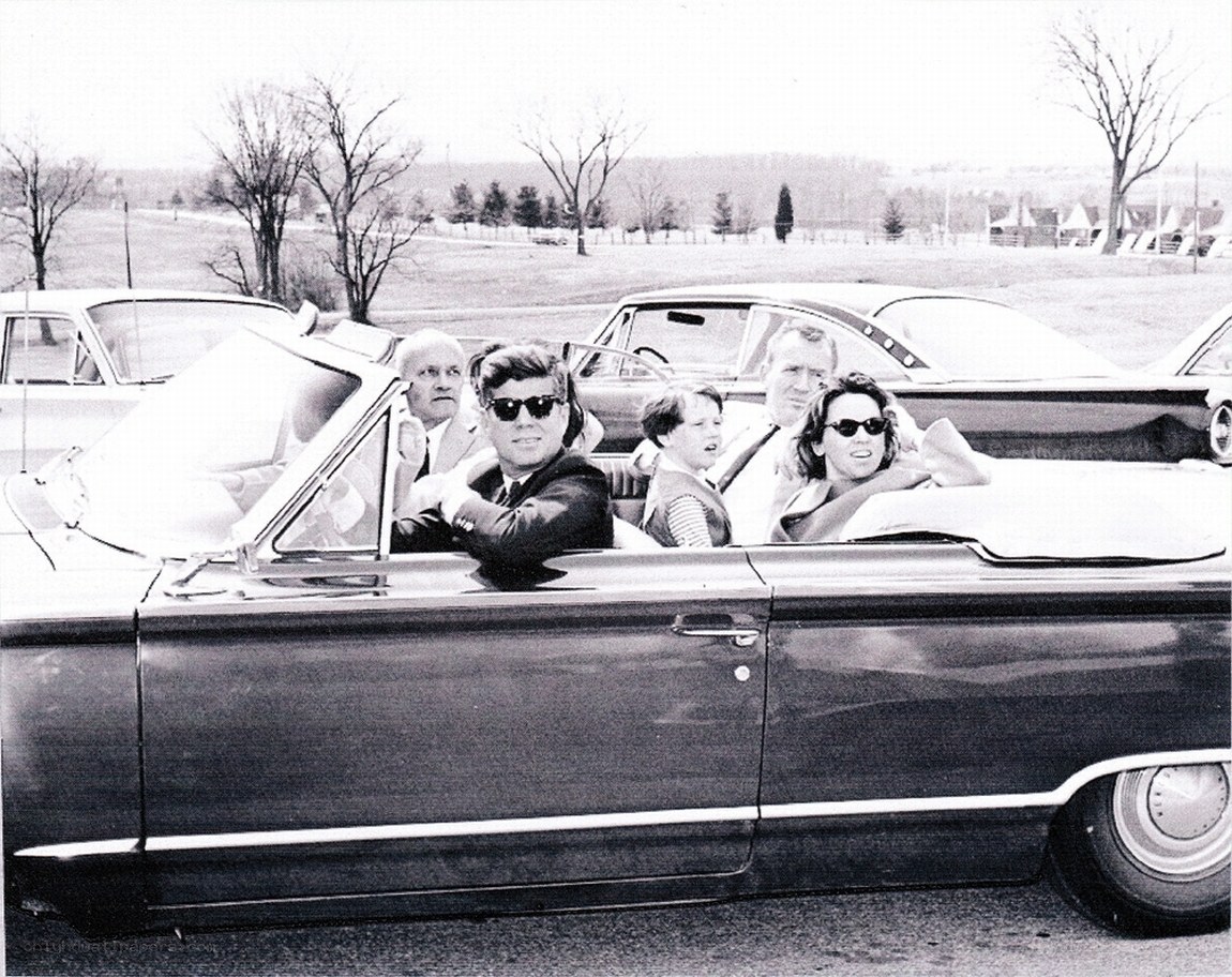 Kennedy family in convertible