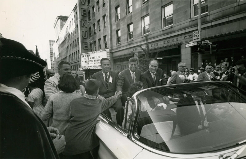 Kennedy in a convertible car